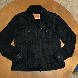 Women’s Levi black denim jacket, sherpa lined. Warm, cozy, size small.